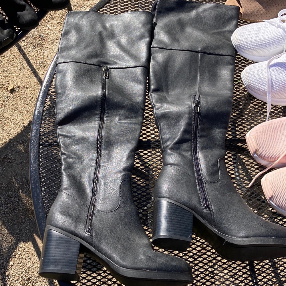Long black boots.